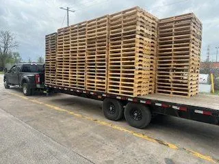 Flatbed trailer loaded with pallets